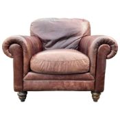 Single armchair upholstered in brown leather