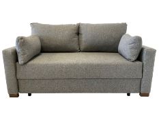 Two seater sofa bed upholstered in light grey fabric