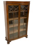 Early 20th century oak bow front glazed bookcase