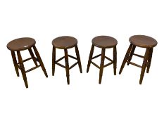 Set of four stained beech stools