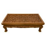 Carved hardwood coffee table