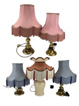 Three various brass table lamps with pink fringed shades and a ceramic vase table lamp (4)