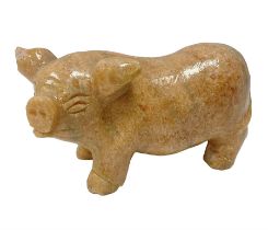 Carved calcite figure in the form of a pig