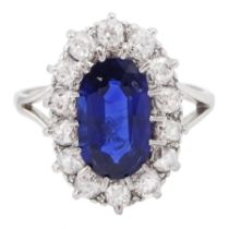 Early - mid 20th century platinum oval cut sapphire and old cut diamond cluster ring