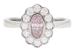 Platinum oval cut fancy pink diamond and round brilliant cut diamond cluster ring