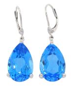 Pair of 18ct white gold pear cut blue topaz and diamond earrings