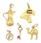 Three 18ct gold pendant / charms including camel
