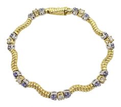 Yellow and white gold round tanzanite and diamond link bracelet