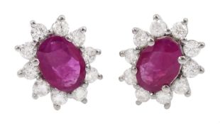 Pair of 18ct white gold oval ruby and round brilliant cut diamond cluster stud earrings