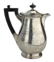 Silver hot water jug of baluster form with ebonised handle and lift