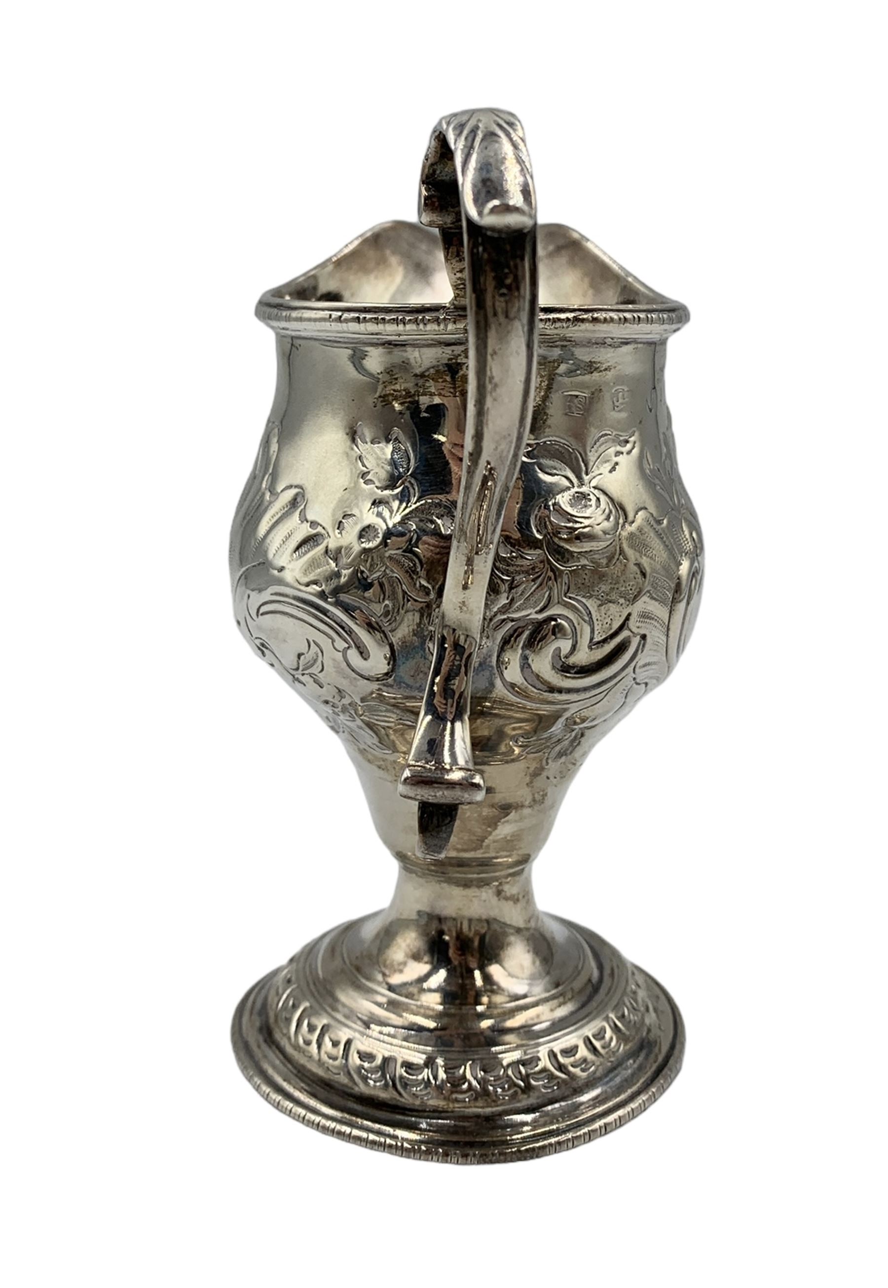 George III silver baluster cream jug with scroll handle and later embossed decoration - Image 2 of 4