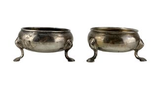 Pair of George III silver circular salts on triple shaped supports D6cm
