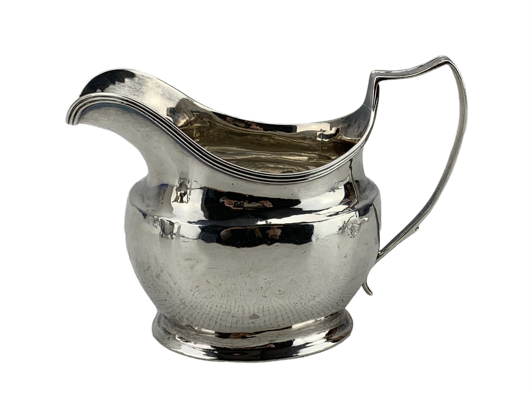 George III silver cream jug with reeded edge and angular handle