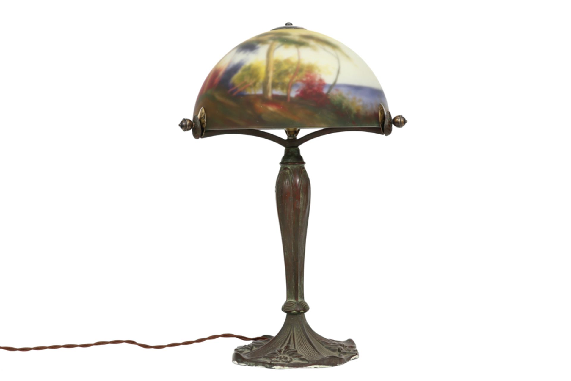 nice lamp with its base in bronze and its shade in glass with a polychrome landscape decor ||