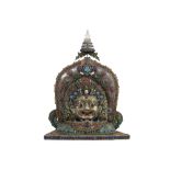 very nice Nepalo-Tibetan temple sculpture with a "Bhairava" mask in silver, adorned with filigrees