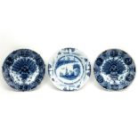 three quite big 18th Cent. dishes in ceramic from Delft with blue-white decor (the pair are