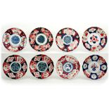 eight antique plates in 19th Cent. Japanese porcelain with Imari decor || Lot van acht borden in