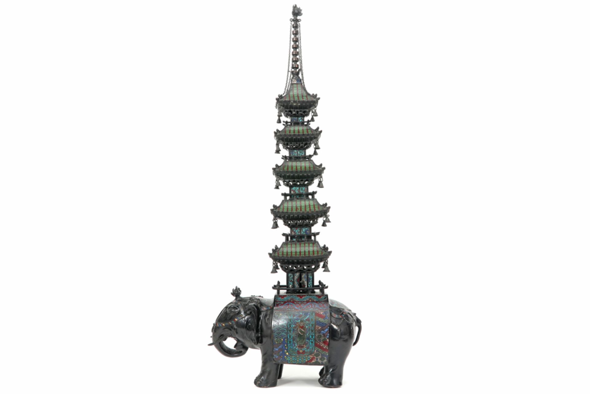 antique Chinese incense burner in bronze with cloisonné in the shape of a pagoda on an elephant ||