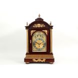 antique quite imposing "Westminster" table-clock with a neoclassical mahogany case with mountings in