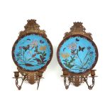 pair of antique wall lights in gilded bronze, each with a Japanese Meiji period cloisonne dish ||