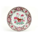 18th Cent. Chinese dish in porcelain with a 'Famille Rose' decor with in the center a cute temple