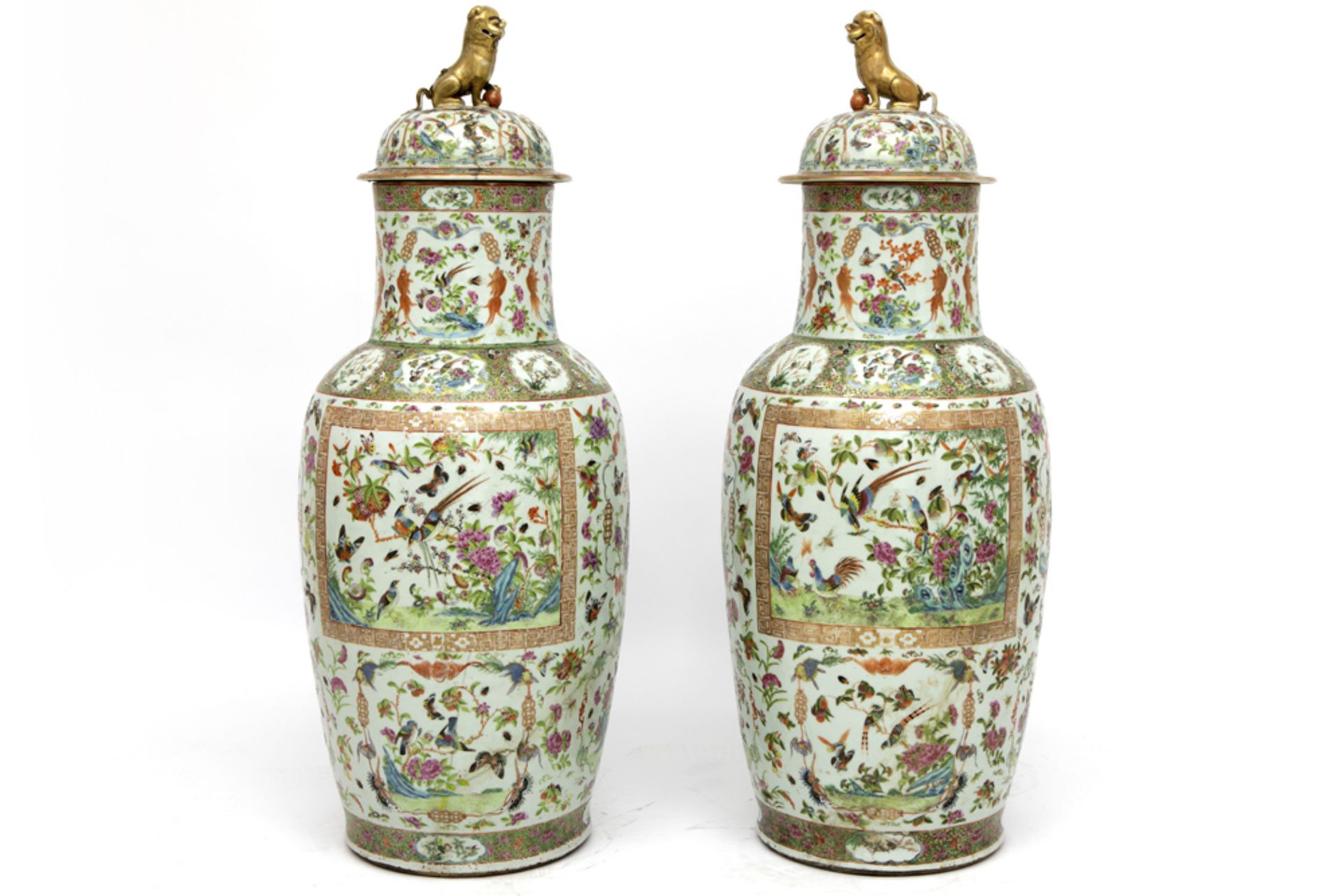 pair of quite big 19th Cent. Chinese lidded vases in porcelain with a Cantonese decor were damaged