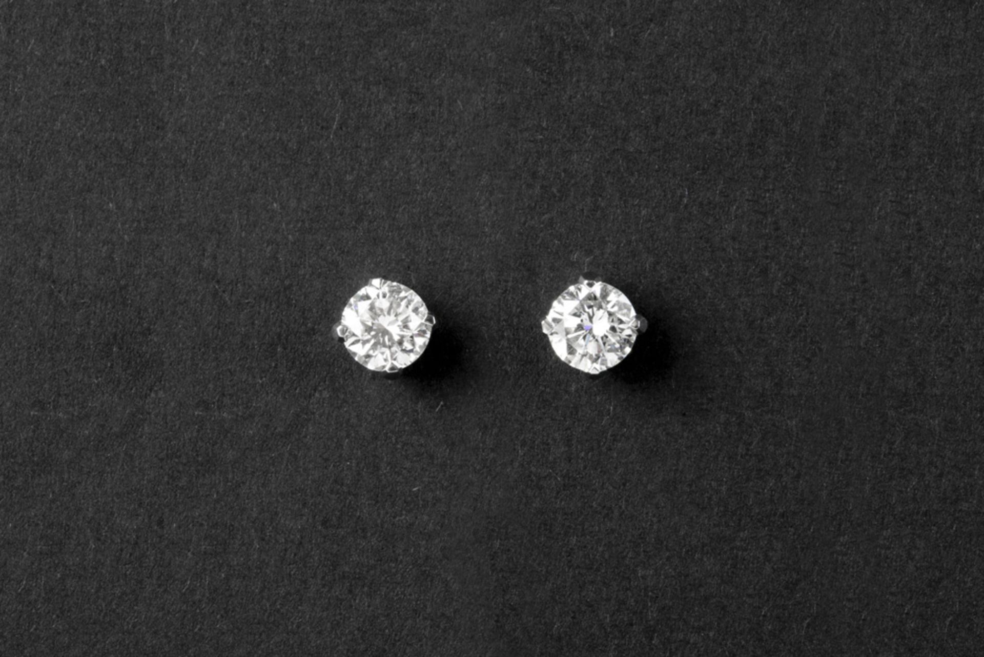 pair of earrings in white gold (18 carat) each with one brilliant - in total : at least 0,85 carat