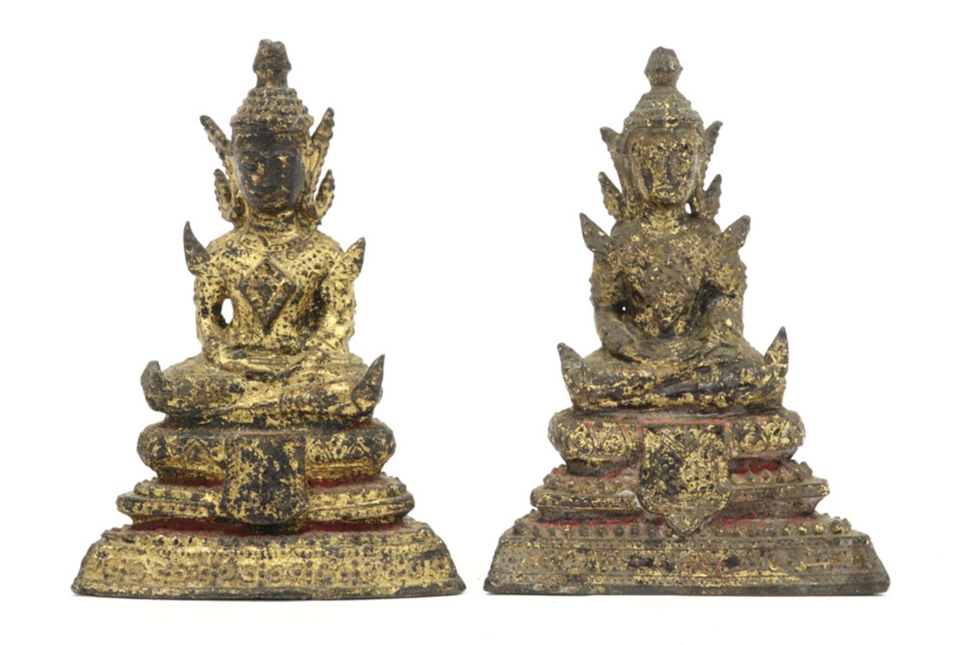 two antique Siamese Rattanakossinperiod "Buddha" sculptures in bronze with remains of the original
