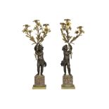 pair of quite big 19th Cent. Napoleon III candelabras, each with a cupid with a bouquet in partially
