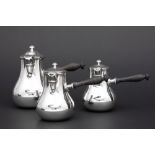 French Cardeilhac signed set of a pair of lidded jugs and a bigger one in marked silver ||