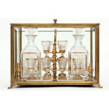 19th Cent. licquor cabinet with case in glass and brass and with its original content of glasses and