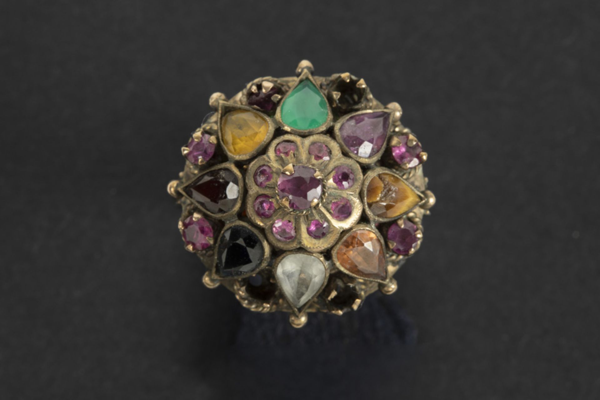 antique ring in pink gold (18 carat) with several precious stones such as emerald, ruby and