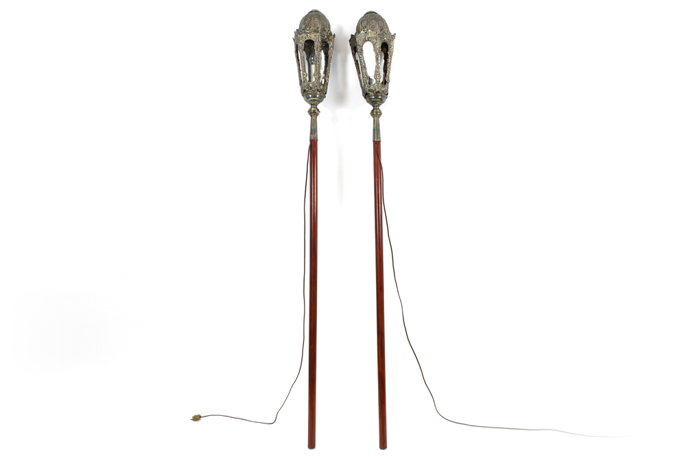 pair of antique procession lamps in "Berlin silver" with a repousse decor - each on a stick||Paar
