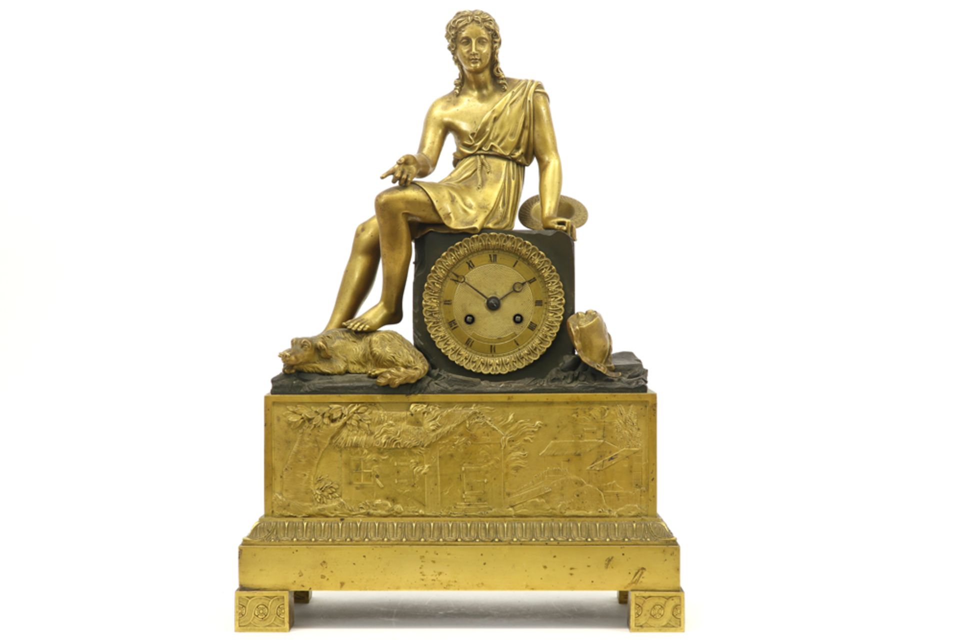 early 19th Cent. French clock in partially gilded bronze with a "Young man with dog" sculpture and a