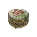 H.R. Limoges marked round pill box in brass and enamel with its lid with a flowers decor||H.R.