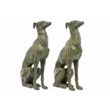 pair of decorative "Sitting dogs" sculptures in bronze with a greenish patina||Paar decoratieve