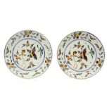 pair of 18th Cent. pancake plates in ceramic from Delft with a polychrome decor with bird||Paar