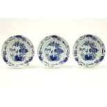 series of three small 18th Cent. plates in ceramic from Delft with a blue-white flowers decor||Serie