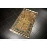 finely knotted Turkish Hereke praying rug in silk on silk with a typical design with mihrab and
