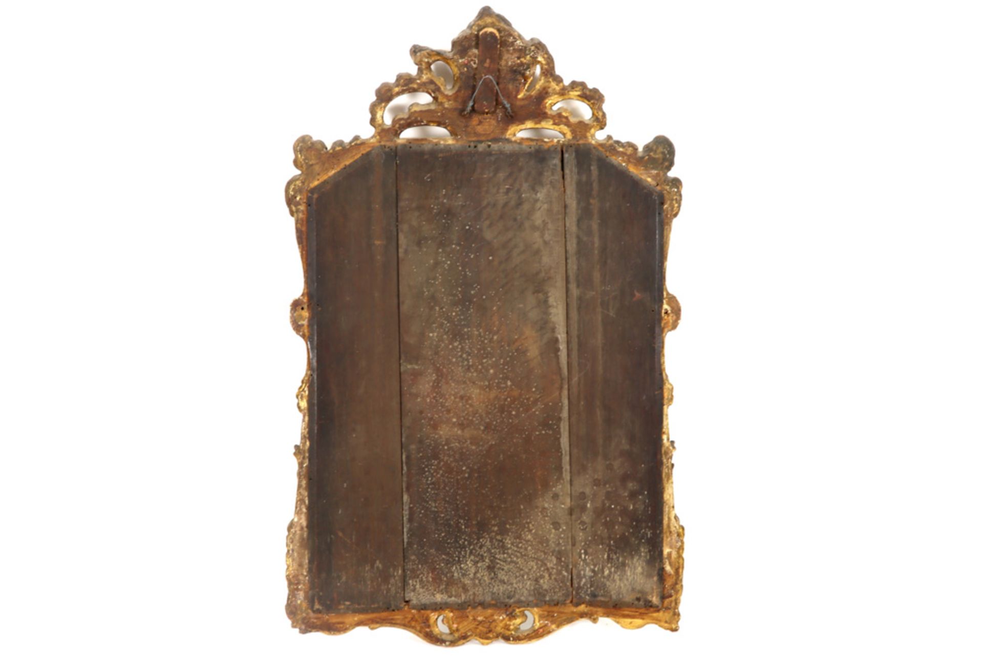 mirror with an 18th Cent. French Louis XV style frame in gilded and sculpted wood with on the back a - Image 2 of 3