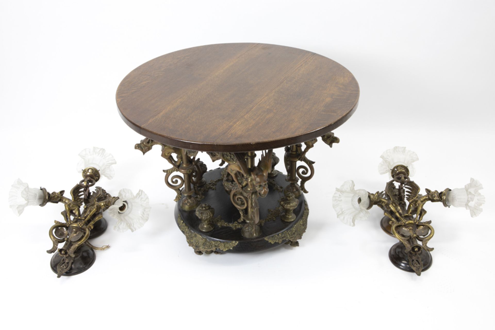 set of a pair of bronze wall lights and an occasional table with bronze base, each with dragons||Set