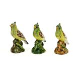 set of three quite rare 18th Cent. 'bird' figures in polychromed ceramic from Delft||Set van drie