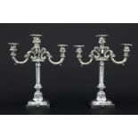 pair of antique candelabra with a neoclassical pillar in marked silver and a top for three candles