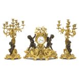 19th Cent. French Louis XV style garniture in gilded bronze adorned with cupids in bronze with a