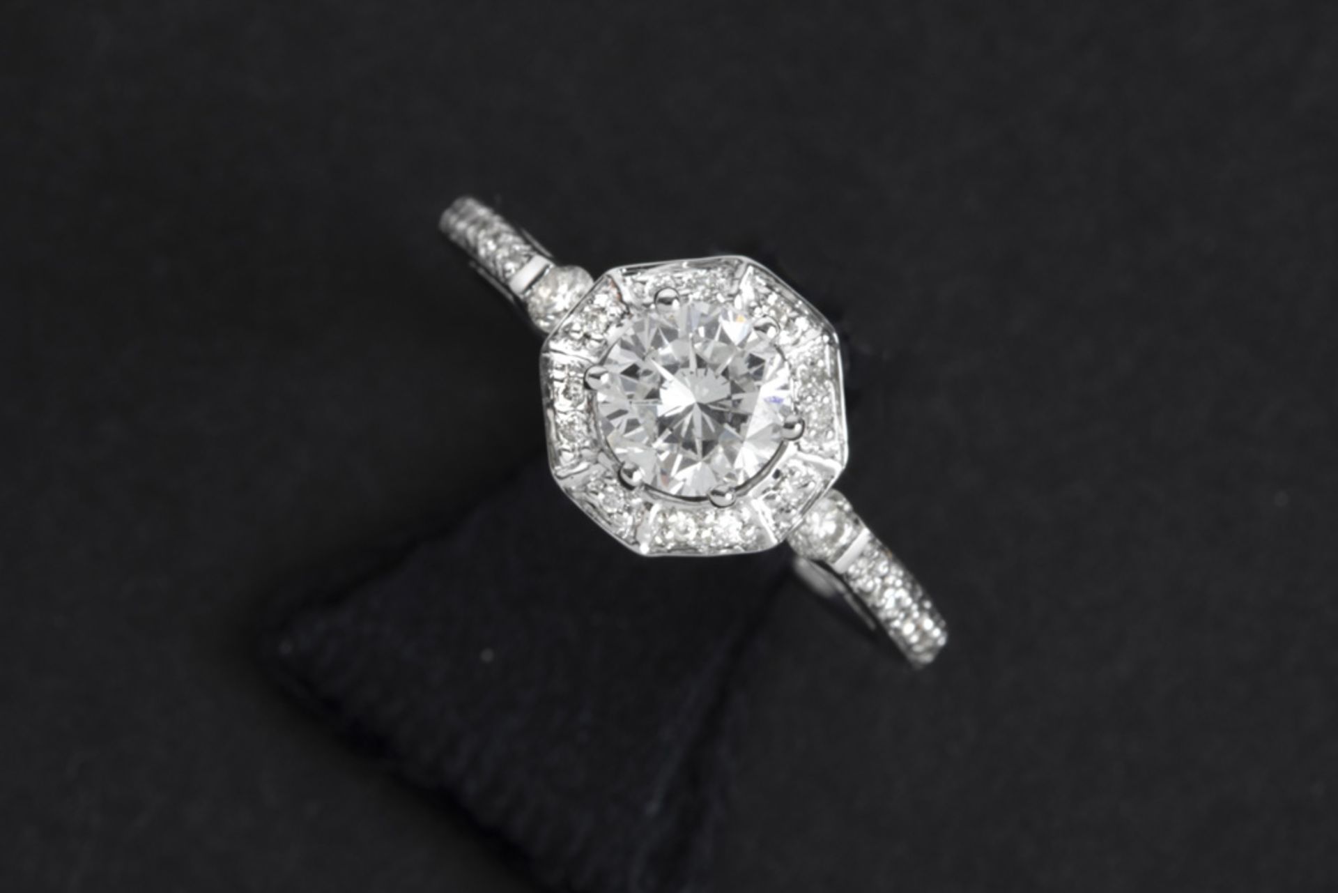 a 0,72 carat high quality brilliant cut diamond set in a ring in white gold (18 carat) with ca 0,