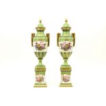 pair of neoclassical lidded vases on base in porcelain with polychrome decor with finely painted
