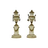 pair of late 18th Cent. Louis XVI style lidded vases on pillar in white marble and gilded bronze||
