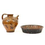 two antique earthenware pieces : a bassin and a vinegar jar||Lot (2) antiek aardewerk met een bekken