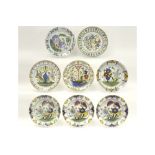 eight quite big round and antique dishes in marked ceramic from delft with a polychrome decor