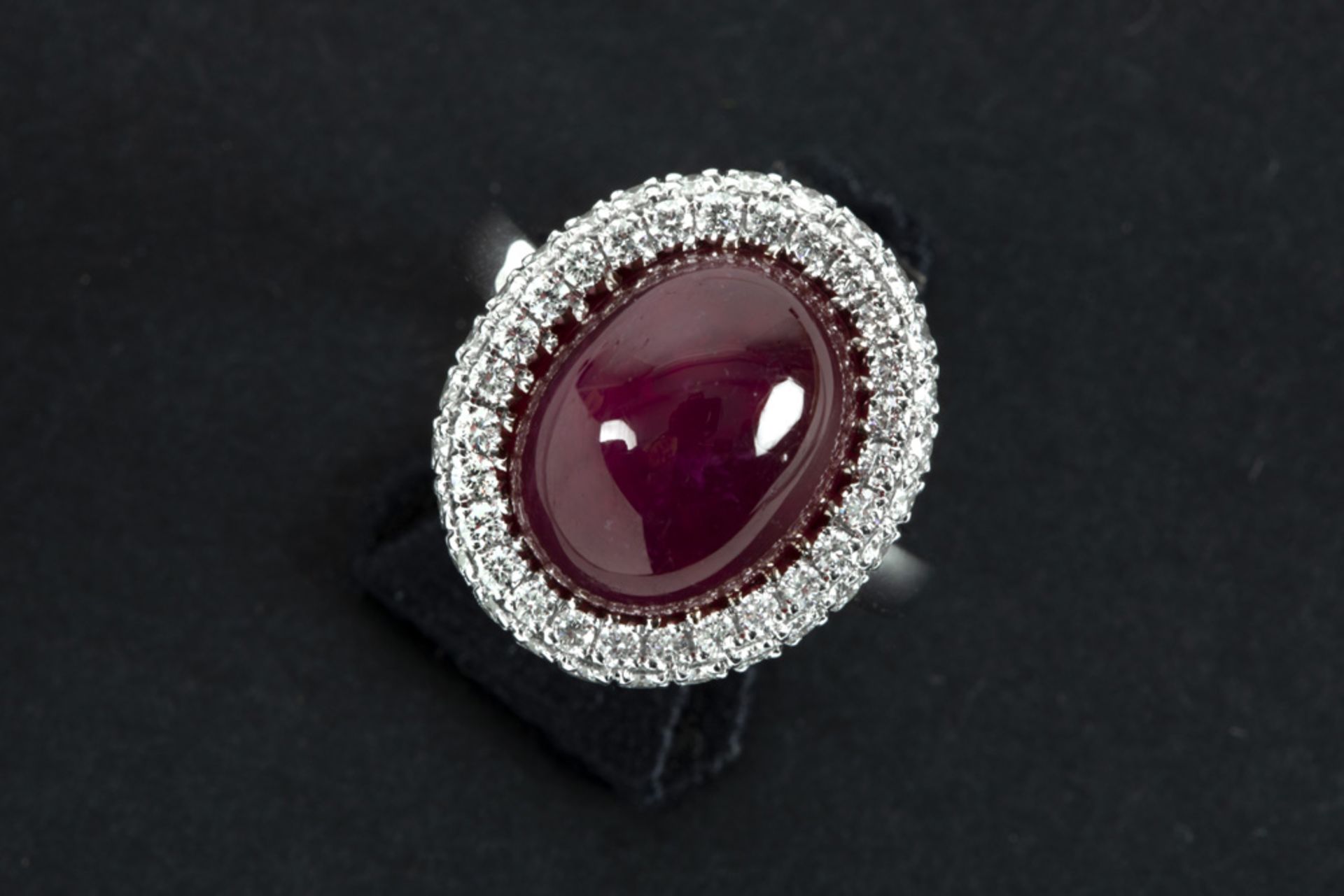 handmade ring in white gold (18 carat) with a treated cabochon cut ruby of more than 14 carat